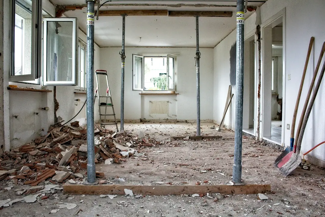 A room under renovation held up by temporary steel props